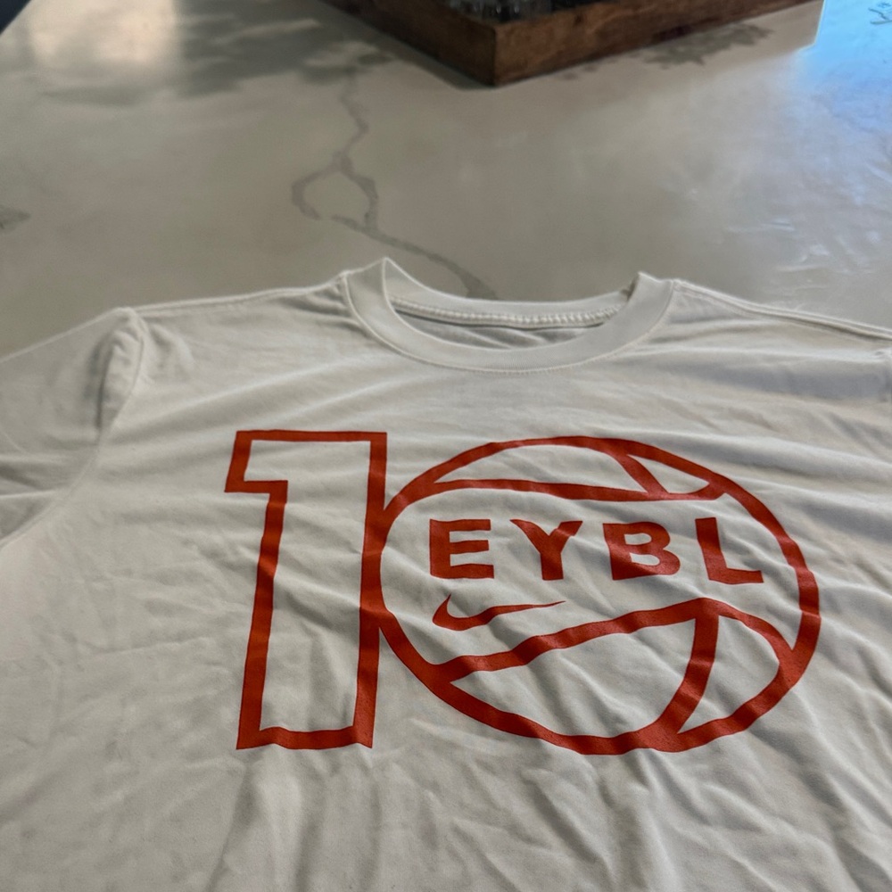 Nike EYBL Dry-fit Men’s White Short-Sleeve Tee with Orange Basketball Graphic